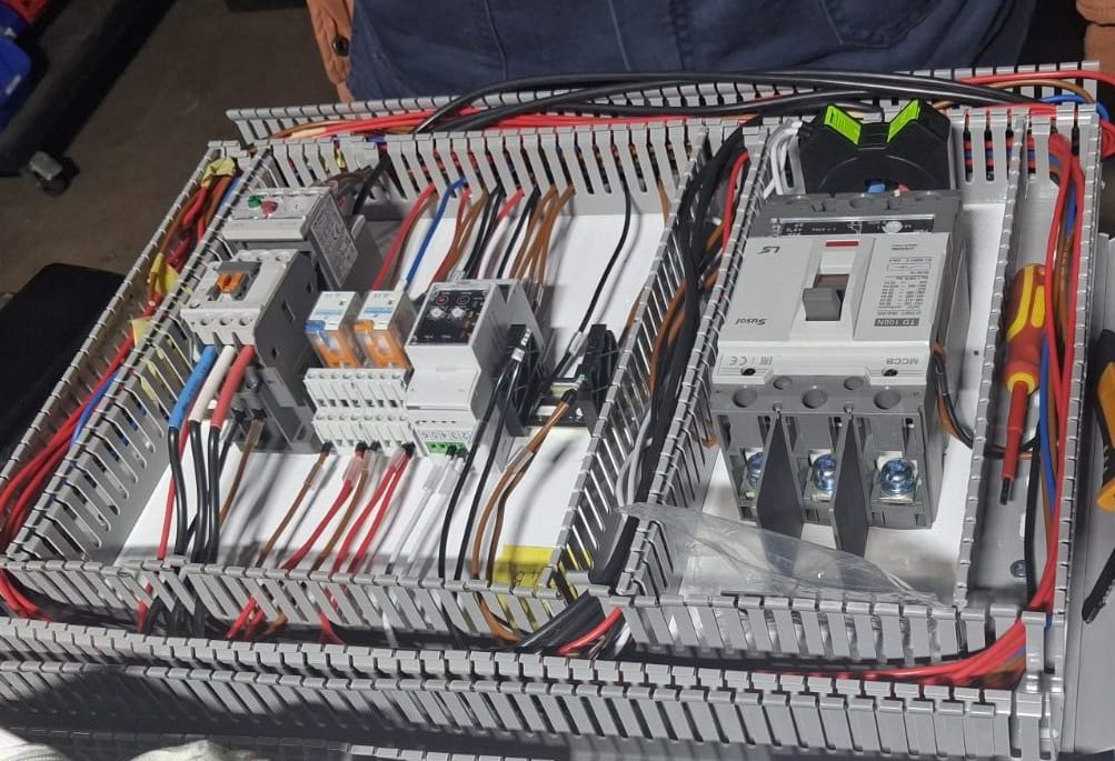 Industrial automation control panel with PLC, Ethernet communications and field instrumentation supporting SCADA software and industrial data management.
